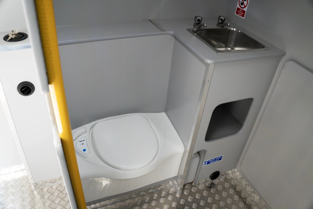 Toilet and hand wash station in the back of a Welfare van
