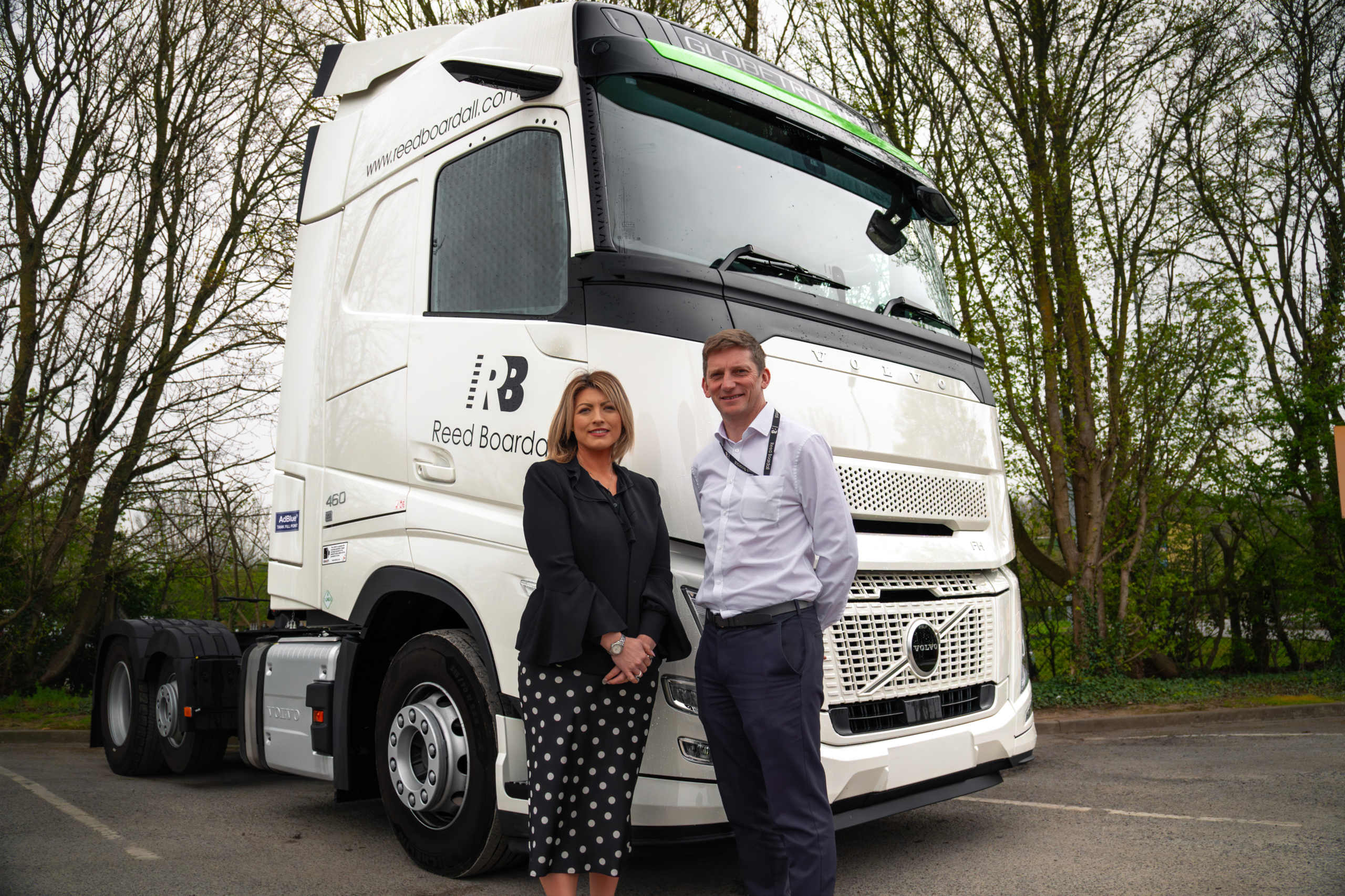 Laura Claughan, SM UK Sales Director, with Ross Morris, Reed Boardall Health and Safety Manager, in front of a Reed Boardall Volvo truck